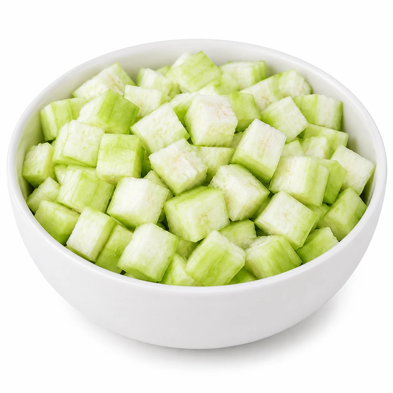 White ceramic bowl filled with freshly diced ridge gourd cubes