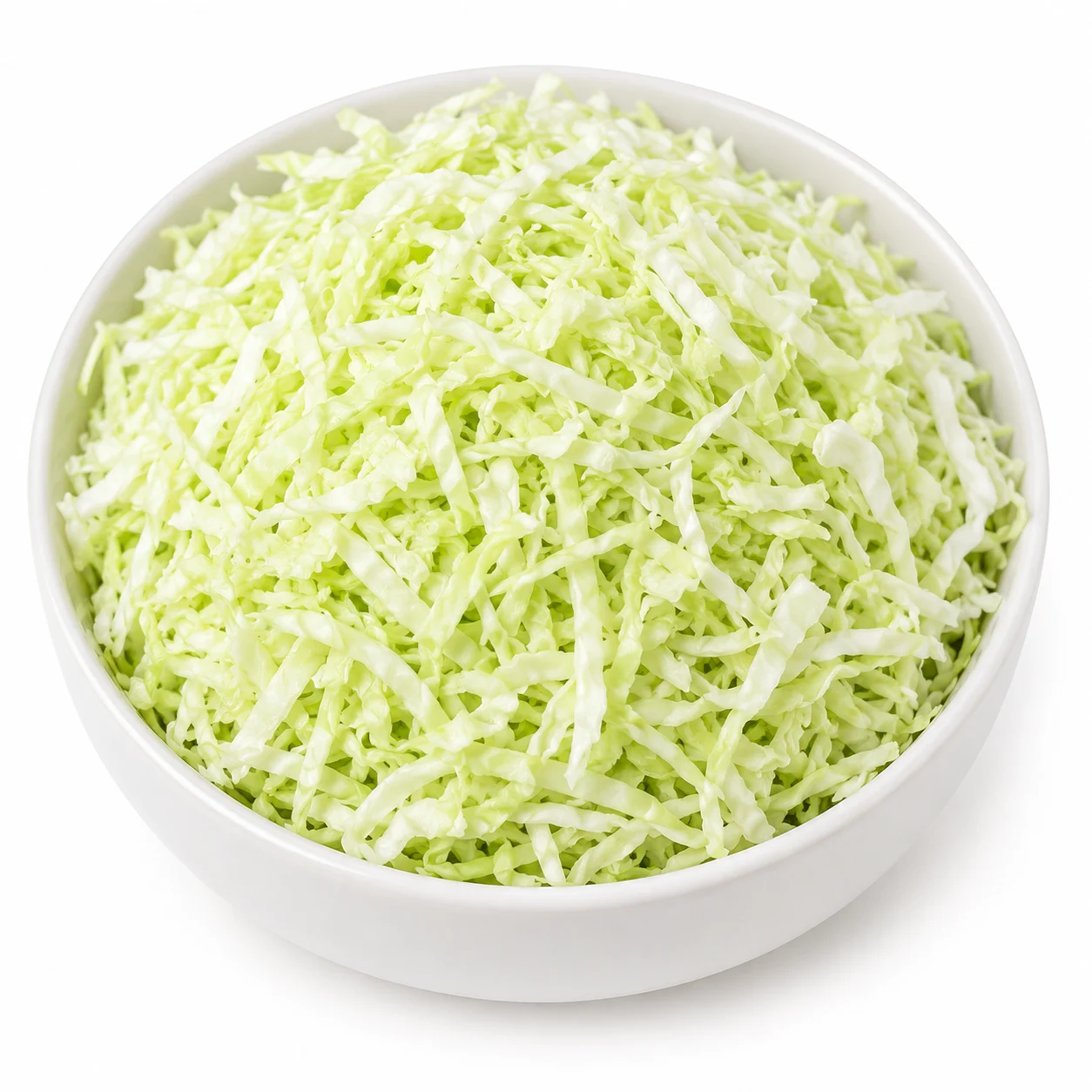 White ceramic bowl filled with freshly shredded cabbage